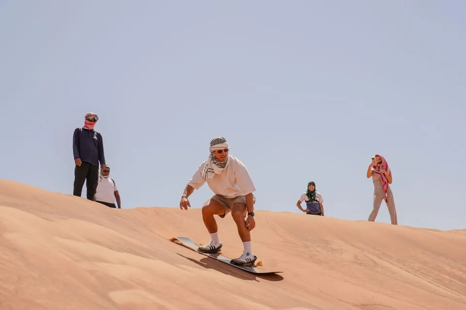 Sandboarding during morning safari